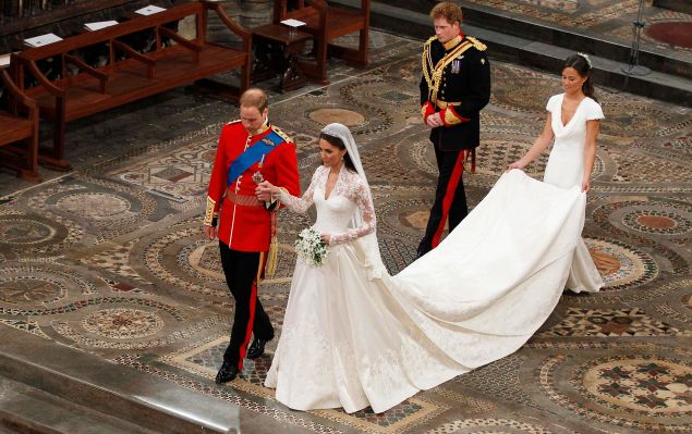 LONDON, ENGLAND - APRIL 29: Prince William takes the hand of his bride Catherine Middleton, now to be known as Catherine, Duchess of Cambridge, followed by Prince Harry and Pippa Middleton as they walk down the aisle inside Westminster Abbey on April 29, 2011 in London, England. The marriage of Prince William, the second in line to the British throne, to Catherine Middleton is being held in London today. The marriage of the second in line to the British throne is to be led by the Archbishop of Canterbury and will be attended by 1900 guests, including foreign Royal family members and heads of state. Thousands of well-wishers from around the world have also flocked to London to witness the spectacle and pageantry of the Royal Wedding.