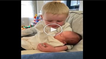Photo of The child became emotional with his younger brother in his arms, the heart of the innocent filled with happiness..Watch video