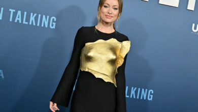 Photo of Olivia Wilde Wears Gold Breastplate Costume on Crimson Carpet: See Images