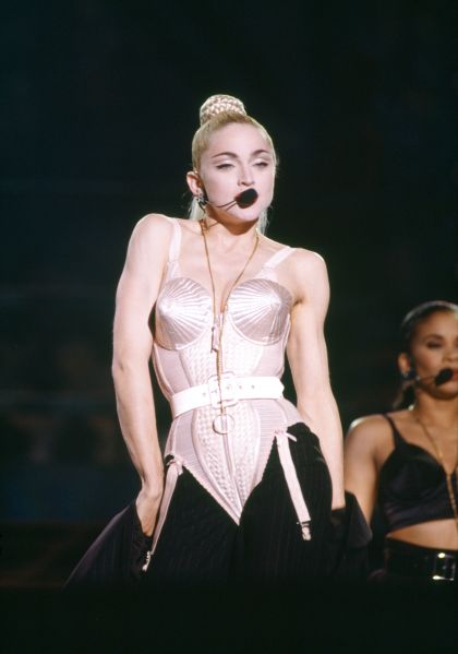 Madonna wearing a white bodysuit cone bra