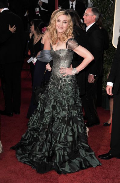 Madonna wearing a grey tiered dress