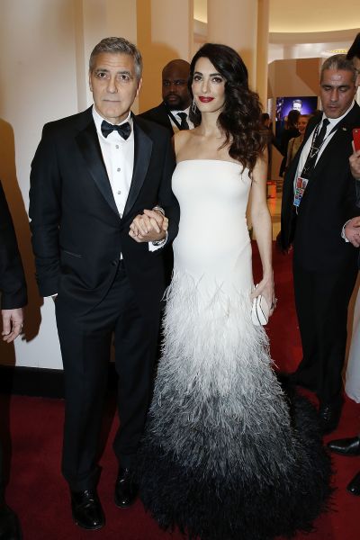 clooney wearing a feathered white gown